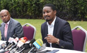 Laikipia MP Mwangi Kiunjuri addressing the media during a past political meeting with Moses Kuria 