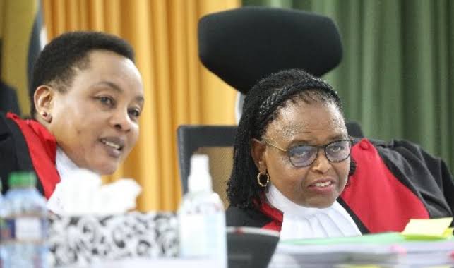 Chief Justice Martha Koome listens as Deputy CJ Philomena Mwilu Chats Her