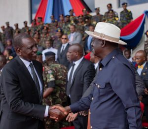 Ruto and Raila shake hands