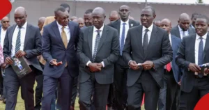 Oscar Sudi chatting with Ruto during a past event