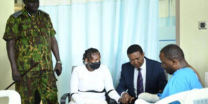 A photo of Nairobi police boss Adamson Bungei, Tourism CS Dr. Alfred Mutua, David Maina's wife and himself in Nairobi West Hospital 