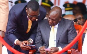 Davis Chirchir chatting with President William Ruto during a past event