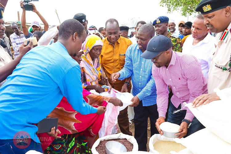 PS Raymond Omollo distributing relief food during a past exercise