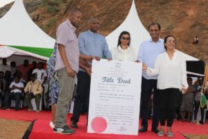 Devki boss Narendra Raval receiving title deed of 500-acres land from 